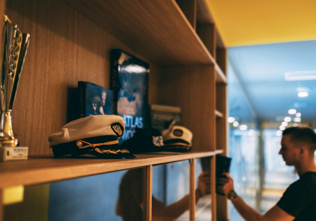 Man taking a book from a shelf