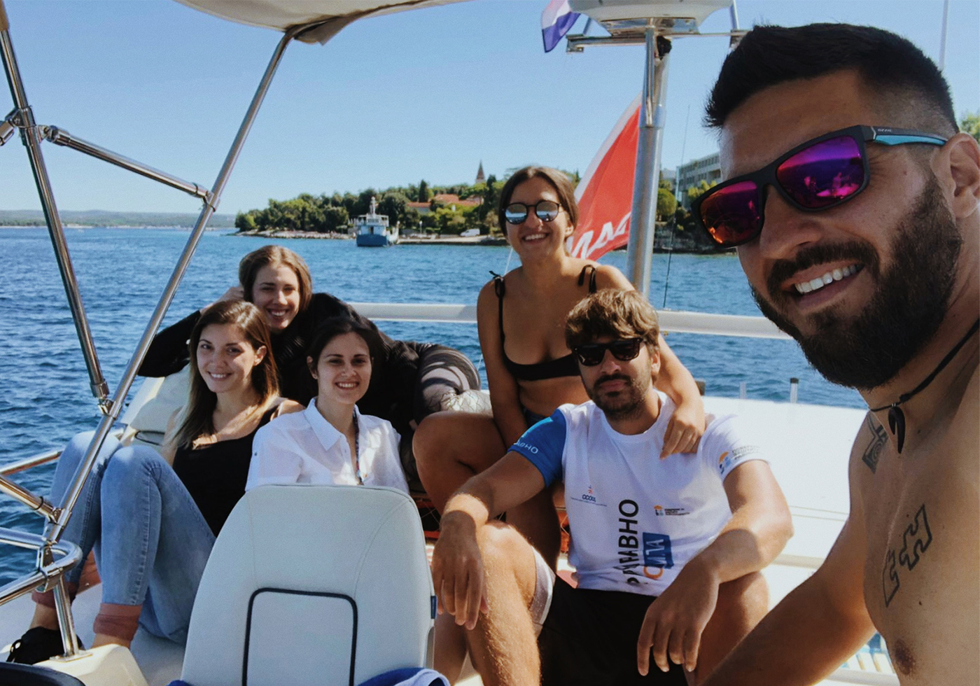 Group of young people on boat in Croatia